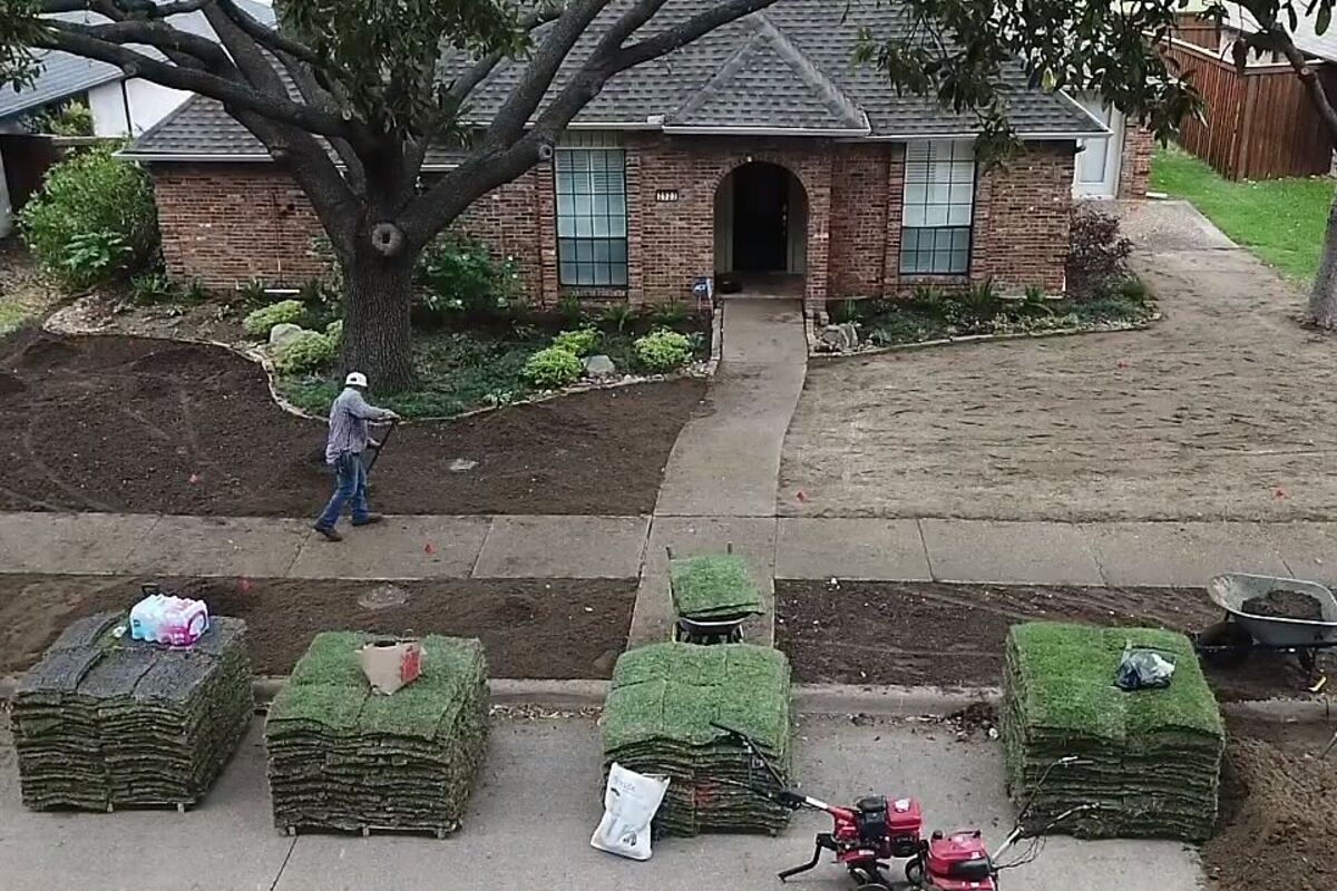 New sod being laid for a lush front lawn